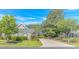 Charming brick home with lush landscaping, driveway, and an American flag on display at 139 Chenoa Dr. # D, Murrells Inlet, SC 29576