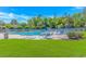 Community pool with lounge chairs, umbrellas, and lush green grass at 139 Chenoa Dr. # D, Murrells Inlet, SC 29576