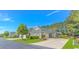 Street view showcasing manicured lawns, matching brick homes, and American flags waving proudly at 139 Chenoa Dr. # D, Murrells Inlet, SC 29576