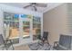 Bright sunroom with large windows, ceiling fan, and seating area with exterior view at 139 Chenoa Dr. # D, Murrells Inlet, SC 29576