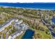 Beautiful aerial view of oceanfront resort with pool, lake, and lush green landscaping at 14290 Ocean Hwy. # 210, Pawleys Island, SC 29585