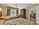 Bedroom with two beds, view into the living room, and a view from a bright window at 14290 Ocean Hwy. # 210, Pawleys Island, SC 29585