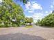 Community entrance with brick pavers, lush trees and a guard gate at 14290 Ocean Hwy. # 210, Pawleys Island, SC 29585