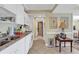 Efficient kitchen with white cabinets, granite countertops, and standard appliances, ideal for meal preparation at 14290 Ocean Hwy. # 210, Pawleys Island, SC 29585