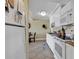 Functional kitchen space equipped with essential appliances, white cabinets, and a view into the dining area at 14290 Ocean Hwy. # 210, Pawleys Island, SC 29585