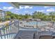 Balcony view of the outdoor pool area with multiple pools and playground at 14290 Ocean Hwy. # 210, Pawleys Island, SC 29585