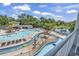 Upper view of the outdoor pools and lazy river, surrounded by lounge chairs at 14290 Ocean Hwy. # 210, Pawleys Island, SC 29585