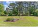 Spacious backyard featuring a beautiful birdbath and a well-maintained lawn at 1486 Medinah Ln., Murrells Inlet, SC 29576