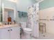 Clean bathroom with a shower including a decorative shower curtain and accessibility features at 1486 Medinah Ln., Murrells Inlet, SC 29576