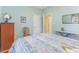 Bedroom with pastel blue walls, and an ironing board next to a neatly made bed at 1486 Medinah Ln., Murrells Inlet, SC 29576