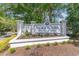 Welcoming sign for Indigo Creek Golf Plantation surrounded by lush landscaping at 1486 Medinah Ln., Murrells Inlet, SC 29576
