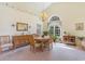 Elegant dining room with a chandelier, large windows, and classic furnishings at 1486 Medinah Ln., Murrells Inlet, SC 29576