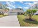 Charming single-story home featuring an attached two-car garage, mature landscaping, and inviting curb appeal at 1486 Medinah Ln., Murrells Inlet, SC 29576