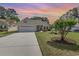 Charming single-story home featuring an attached two-car garage, mature landscaping, and inviting curb appeal at 1486 Medinah Ln., Murrells Inlet, SC 29576