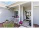 Welcoming front porch with seating and decorative touches, leading to the home's entrance at 1486 Medinah Ln., Murrells Inlet, SC 29576