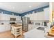 Bright kitchen features stainless steel appliances and white countertops and cabinets at 1486 Medinah Ln., Murrells Inlet, SC 29576