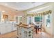 Charming kitchen featuring an island, bright windows, and a dining area, perfect for Gathering meals at 1486 Medinah Ln., Murrells Inlet, SC 29576