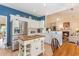 Bright kitchen features stainless steel appliances, white cabinets and kitchen island at 1486 Medinah Ln., Murrells Inlet, SC 29576