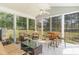 Relaxing sunroom with comfortable seating, lots of natural light, and a view of the outdoors at 1486 Medinah Ln., Murrells Inlet, SC 29576