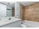Cozy bathroom featuring a single sink vanity, mirror, and a tiled shower over a bathtub at 1500 Cenith Dr. # F103, North Myrtle Beach, SC 29582