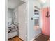 Hallway with an open doorway to a bedroom and a view of an exterior entrance with an anchor at 1500 Cenith Dr. # F103, North Myrtle Beach, SC 29582
