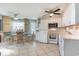 Bright kitchen featuring white appliances, tile floor, and breakfast nook at 1500 Cenith Dr. # F103, North Myrtle Beach, SC 29582
