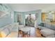 Bright living room featuring hardwood floors, light walls, and patio access at 1500 Cenith Dr. # F103, North Myrtle Beach, SC 29582