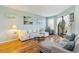Bright living room featuring hardwood floors, light walls, and patio access at 1500 Cenith Dr. # F103, North Myrtle Beach, SC 29582