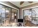 Enclosed patio with seating area and a view through sliding glass doors into the home at 1500 Cenith Dr. # F103, North Myrtle Beach, SC 29582
