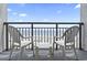 Balcony features chairs and a table, providing a perfect spot to enjoy the beach views and ocean breeze at 1501 South Ocean Blvd. # 643, Myrtle Beach, SC 29577