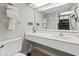 Clean bathroom with a white vanity and a large mirror, providing ample space and functionality at 1501 South Ocean Blvd. # 643, Myrtle Beach, SC 29577