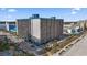 Aerial view showcases a vibrant condo building with balconies and pool in a stunning beachfront setting at 1501 South Ocean Blvd. # 643, Myrtle Beach, SC 29577