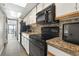 Functional kitchen includes essential appliances, granite countertops, and ample cabinet space for convenient meal preparation at 1501 South Ocean Blvd. # 643, Myrtle Beach, SC 29577
