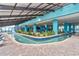 Beautiful indoor lazy river with a unique brick border and tropical plants, creating a serene and inviting atmosphere at 1501 South Ocean Blvd. # 643, Myrtle Beach, SC 29577