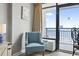 Cozy living area features chairs and balcony with ocean view at 1501 South Ocean Blvd. # 643, Myrtle Beach, SC 29577