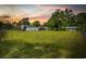 Beautiful backyard with a well-maintained lawn, shed, and patio furniture perfect for outdoor gatherings at 153 Busbee St., Conway, SC 29526