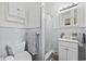 Classic bathroom with blue tile, a toilet, a vanity, and a shower-tub combination at 153 Busbee St., Conway, SC 29526