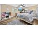Bright bedroom featuring hardwood floors, a TV, and a display shelf filled with various yarns at 153 Busbee St., Conway, SC 29526