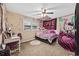 Decorated bedroom with a bed, desk and chair with pink and black accents at 153 Busbee St., Conway, SC 29526