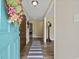 Inviting entryway features fresh floors, neutral walls, and a glimpse into the home's stylish interior at 153 Busbee St., Conway, SC 29526