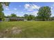 Exterior view of the charming brick ranch-style home with a well-maintained lawn and mature trees at 153 Busbee St., Conway, SC 29526
