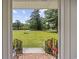 Inviting front porch with wrought iron railing and a manicured lawn at 153 Busbee St., Conway, SC 29526