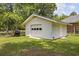 Detached garage offering ample storage space with a single-car garage door and a convenient side entrance at 153 Busbee St., Conway, SC 29526