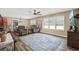 Cozy living area boasts ample natural light, a ceiling fan, and is connected to a dining area at 153 Busbee St., Conway, SC 29526