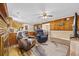 Open living space with cozy seating, view of the kitchen, and a fireplace at 153 Busbee St., Conway, SC 29526