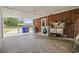 Covered outdoor area with laundry hookups, a utility sink, and views of the fenced yard at 153 Busbee St., Conway, SC 29526