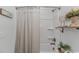 Well-lit bathroom featuring a shower-tub combination with a neutral shower curtain and elegant decor at 1546 Villena Dr., Myrtle Beach, SC 29579