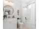 Elegant bathroom showcasing a modern vanity, round mirror, and shower-tub combination for relaxation at 1546 Villena Dr., Myrtle Beach, SC 29579
