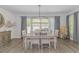 Dining room featuring neutral paint, modern lighting, and luxury vinyl plank flooring at 1546 Villena Dr., Myrtle Beach, SC 29579