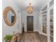 Welcoming foyer features wood-look flooring, decorative lighting, and an accent mirror at 1546 Villena Dr., Myrtle Beach, SC 29579